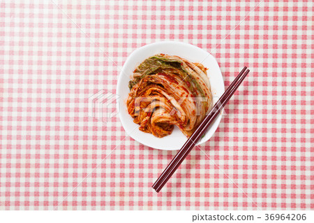 Kimchi with chopsticks in a dish Kimchi with chopsticks in a dish 36964206