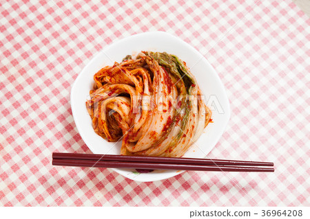 Kimchi with chopsticks in a dish Kimchi with chopsticks in a dish 36964208