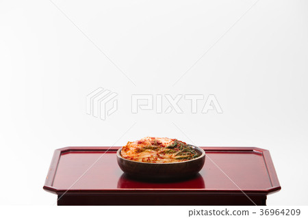 Kimchi in wooden bowl on wood desk 36964209