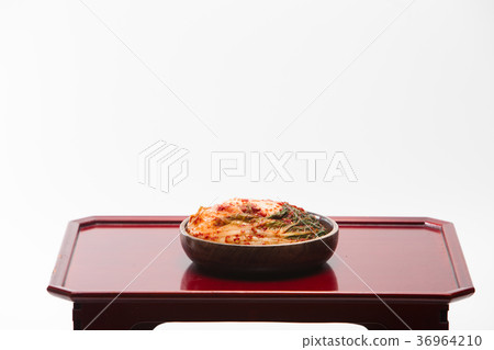 Kimchi in wooden bowl on wood desk 36964210