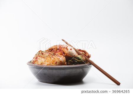 Chopsticks with kimchi in crock head isolated Chopsticks with kimchi in crock head isolated 36964265