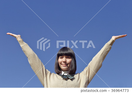 High school student who opens both hands High school student who opens both hands 36964773