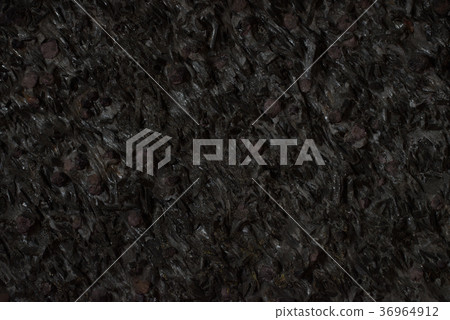 Natural black stone texture closeup, dark grey Natural black stone texture closeup, dark grey 36964912