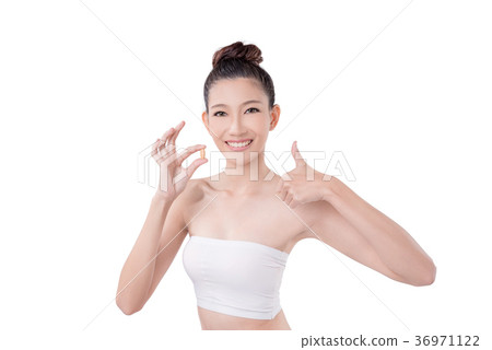 Woman holding vitamin over white background 36971122