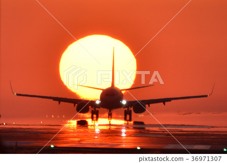 Airplane scenery in the background of a beautiful sunset Airplane scenery in the background of a beautiful sunset 36971307