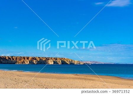 Picturesque beach landscape with cliffs Picturesque beach landscape with cliffs 36971352