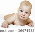 A child on a white background with blue eyes 36974582