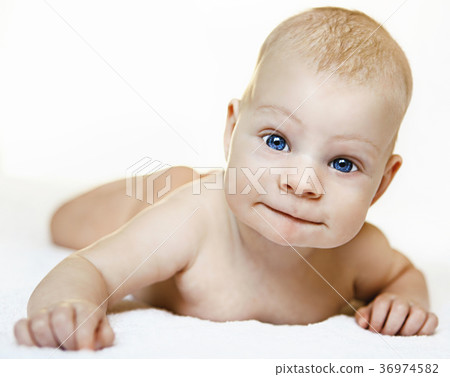 A child on a white background with blue eyes A child on a white background with blue eyes 36974582