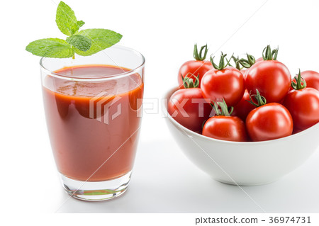 Ripe cherry tomatoes and tomato juice Ripe cherry tomatoes and tomato juice 36974731