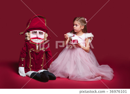 The beauty ballerina standing with nutcracker 36976101