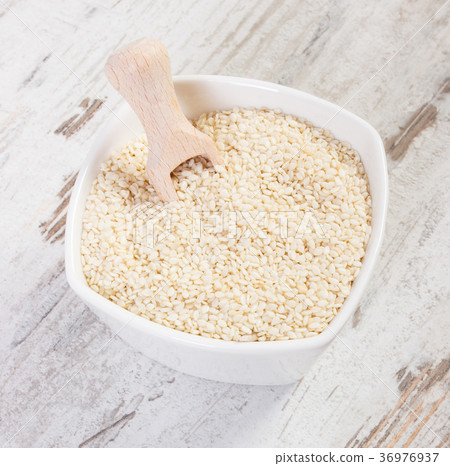 Heap of sesame containing calcium and fiber Heap of sesame containing calcium and fiber 36976937