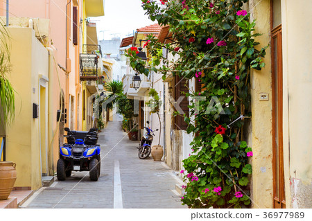 Greek street with Quad Bike and scooter, Crete Greek street with Quad Bike and scooter, Crete 36977989