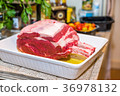 Raw beef Rib steak with bone in roasting tray on 36978132