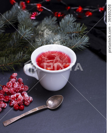 tea from fresh red viburnum in a white ceramic cup 36980208