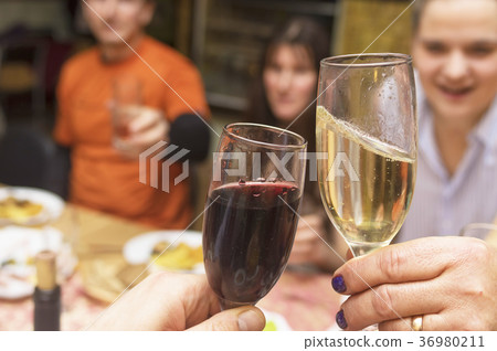 clinking of liquor during a feast clinking of liquor during a feast 36980211