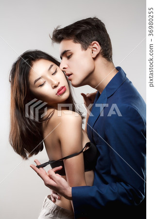 Portrait of a Teenage Couple Embracing. 36980255