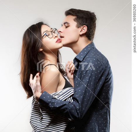 Portrait of a Teenage Couple Embracing. 36980260