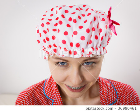 Funny woman wearing pajamas and bathing cap Funny woman wearing pajamas and bathing cap 36980461