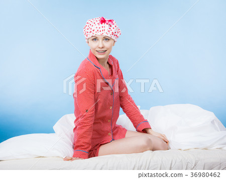 Funny woman wearing pajamas and bathing cap Funny woman wearing pajamas and bathing cap 36980462