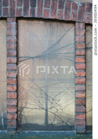 Broken window in old factory building Broken window in old factory building 36980494