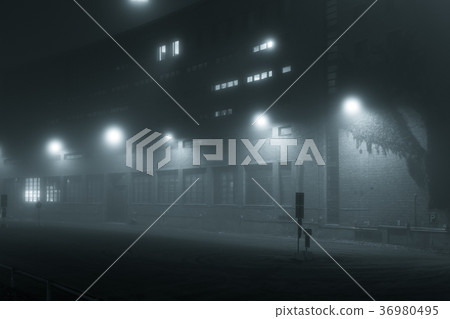 Empty street at foggy night 36980495