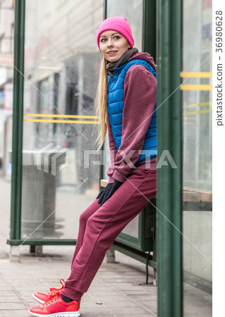 Woman wearing sportswear exercising outside during autumn Woman wearing sportswear exercising outside during autumn 36980628