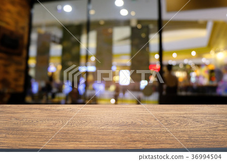 Empty wood table top and blur of night market  36994504