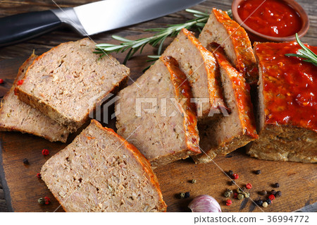 meatloaf cut in slices on board 36994772