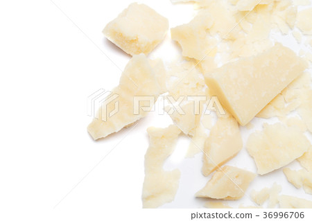 Small pieces of parmesan cheese on white 36996706