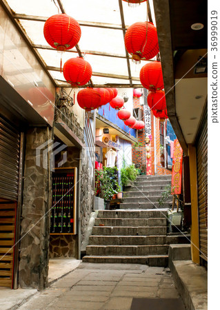 Street in Jiufen village hillside buildings Street in Jiufen village hillside buildings 36999019