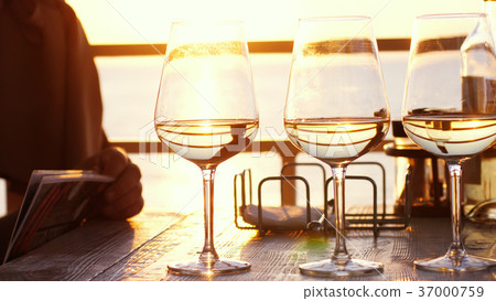 A romantic dinner in summer on a beach at sunset 37000759