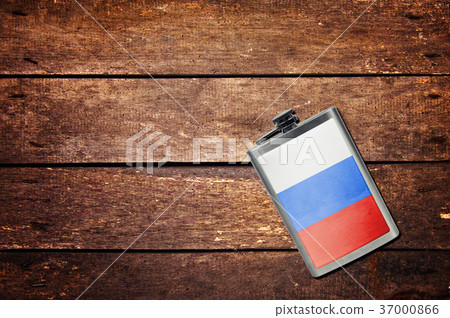 Alcohol flask on the table with flag Alcohol flask on the table with flag 37000866