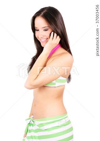 Young girl chatting on a cell phone 37003456