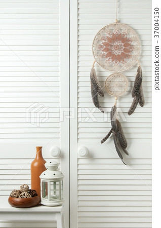 Beige brown dream catcher on white door 37004150