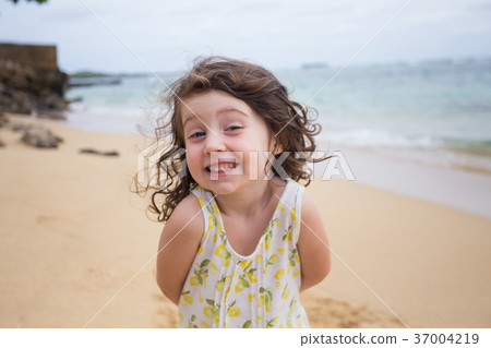 Child Playing on Beach in Oahu Hawaii 37004219