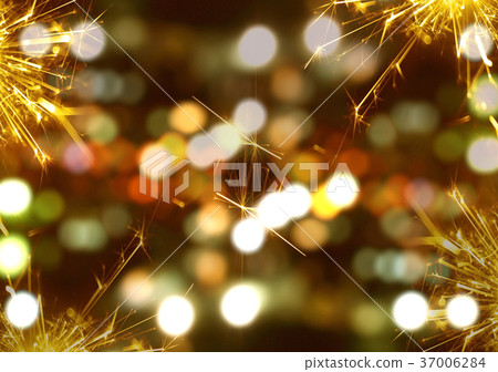 Sparkler fire with bokeh background at night Sparkler fire with bokeh background at night 37006284