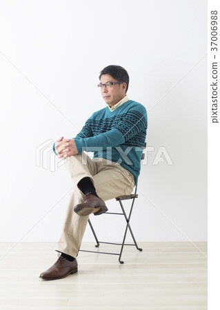 Middle men sitting in a chair 37006988