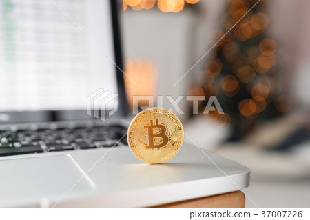 coin bitcoin on the laptop keyboard. the concept 37007226