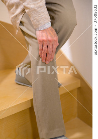 Senior woman elderly old man going down stairs Senior woman elderly old man going down stairs 37008632