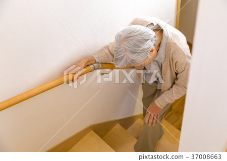 Senior female elderly old man going up stairs Senior female elderly old man going up stairs 37008663