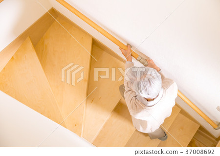 Senior female elderly old man going up stairs 37008692
