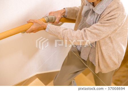 Senior female elderly old man going up stairs 37008694