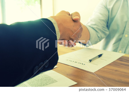 Business man handshake for sucess Business man handshake for sucess 37009064