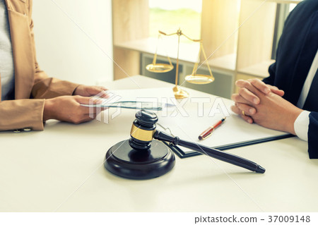 Judge lawyer gavel with bribe money in law firm 37009148
