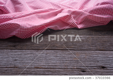 red checkered tablecloth on wooden background 37010366