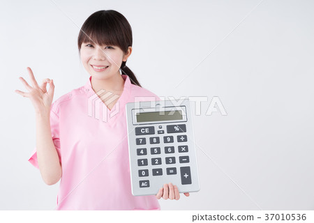 Medical worker holding calculator and ok sign 37010536
