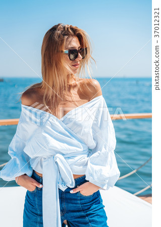 beautiful woman on a beach bed beautiful woman on a beach bed 37012321
