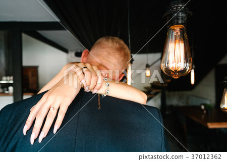 retro bulbs lights. newlyweds couple embracing 37012362