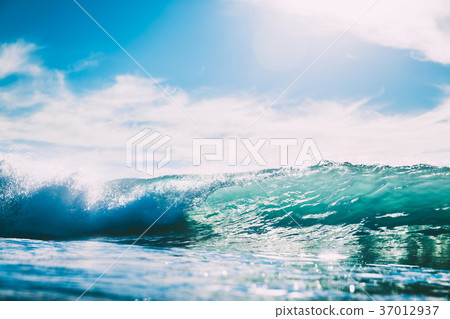 Blue wave in ocean. Glass wave and sun light 37012937