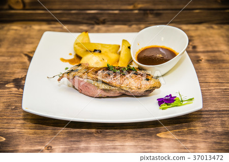 Food on a plate, on a wooden background 37013472